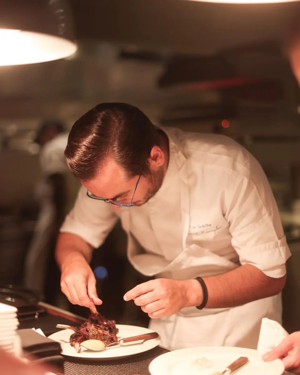 Chef Yiannis Kioroglou plating at the pass