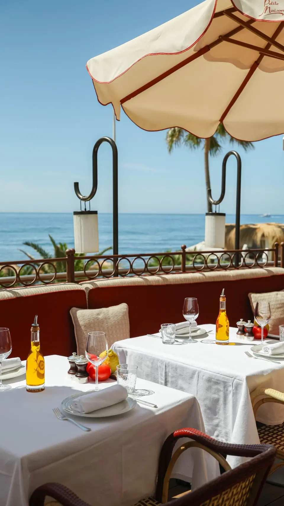 A table under a parasol beside the sea